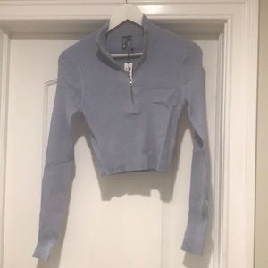 Garage 1/2 zip beautiful long sleeve sweater.  Never worn.  Tags still on.